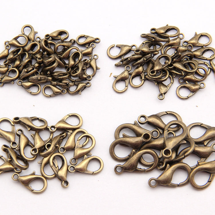 Bronze tone lobster claw clasps scattered, small loop-and-hook metal connectors