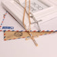 Two cross pendant necklaces with gold and silver rhinestone pendants