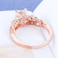 Rose gold zircon engagement ring with ornate filigree setting