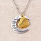 Silver-tone necklace pendant with half-moon charm and gold heart engraved greeting