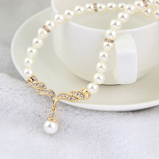 Gold-tone pearl bead choker with central leaf crystal detail and dangling pearl pendant