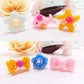 Children's resin cartoon rings (100 pcs) featuring star, bunny, flower, and heart shapes