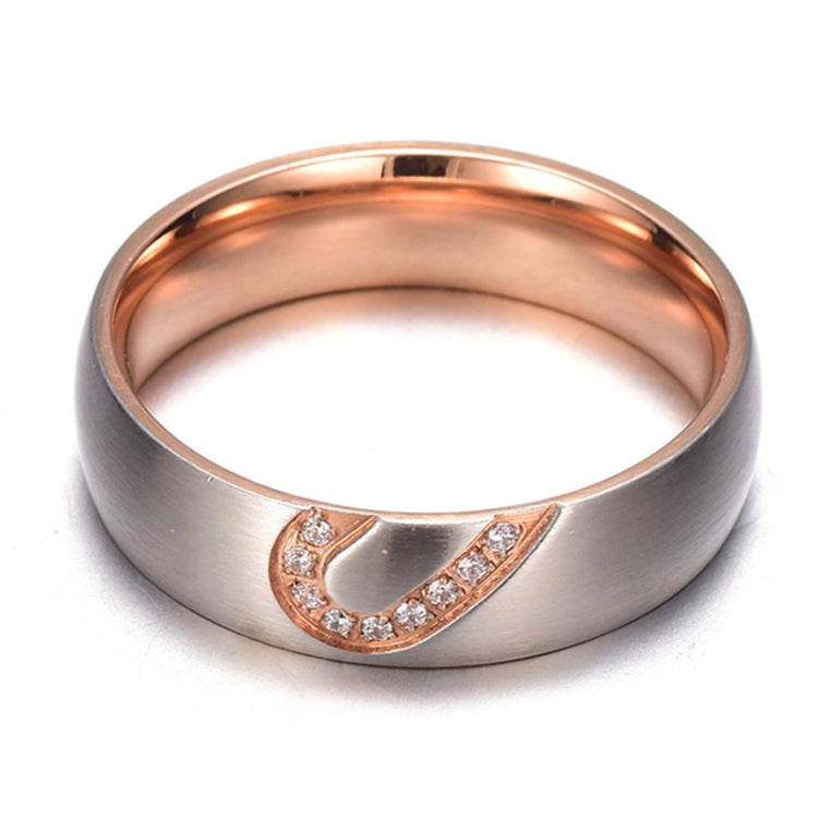 Two-tone ring with rhinestone heart centerpiece on a brushed metal band
