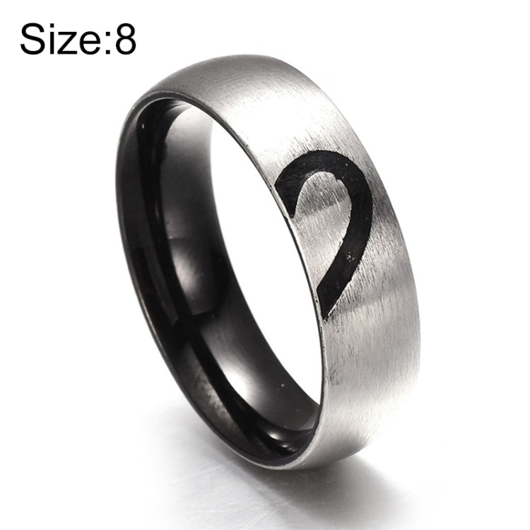 Silver-tone ring with black inner band and heart cutout on the top