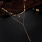Gold double-layer chain necklace with star charm and dangling long bar pendant