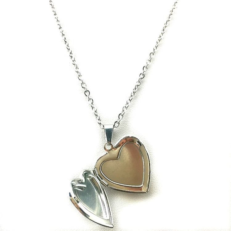 Two heart pendants on silver-tone chains: tan and light blue heart colors
