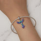 Rainbow enamel phoenix pendant bracelet on wrist with silver clasp