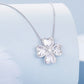Silver-tone lucky clover pendant necklace with heart-shaped center stone and four petals