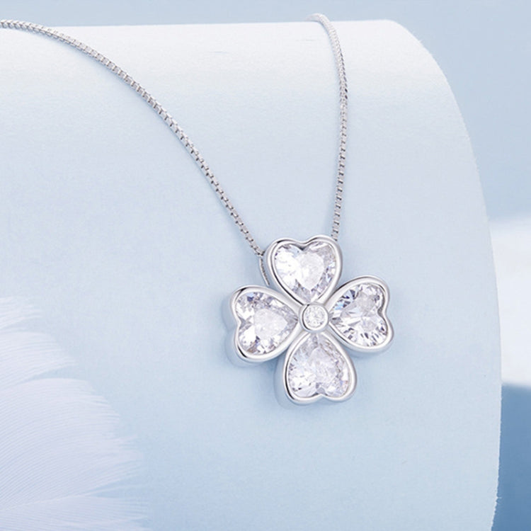 Silver-tone lucky clover pendant necklace with heart-shaped center stone and four petals