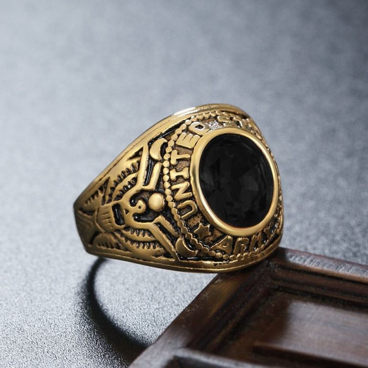 Gold-tone soldier emblem ring with black oval gemstone, angled view