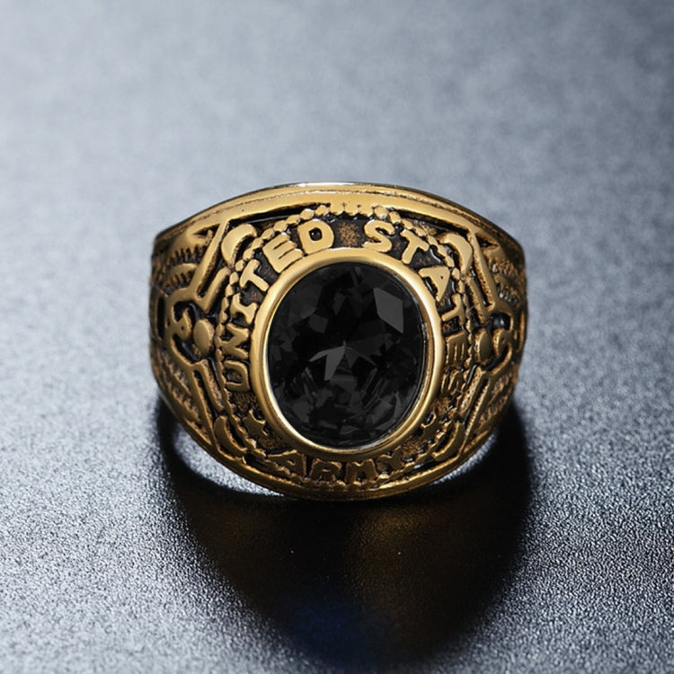 Gold-tone soldier emblem ring with large black oval gemstone and engraved band