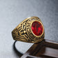 Gold-tone soldier emblem ring with red oval gemstone and engraved military-style band