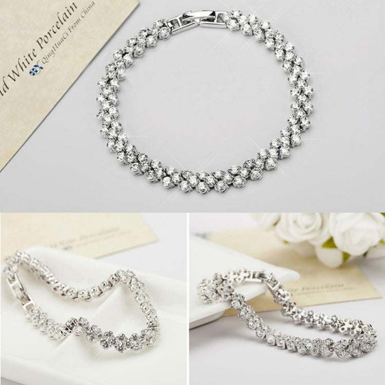 Platinum-tone zircon tennis bracelet with clustered round stones and box clasp