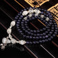 Navy beaded bracelet with silver heart charms and bead tassel detail