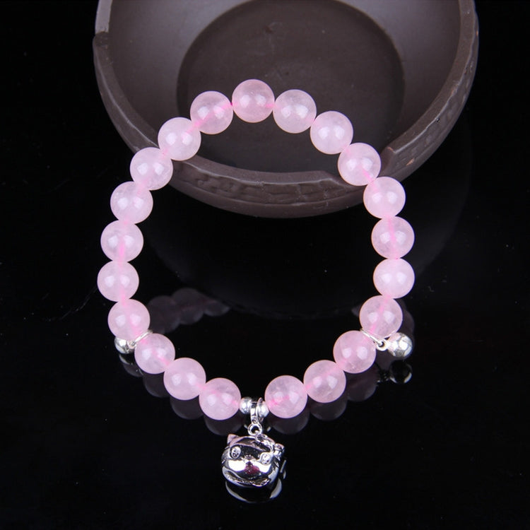 Pink beaded bracelet with silver cat-face charm, elastic stretch band