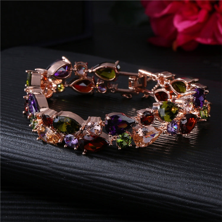 Rose gold multicolor zircon tennis-style bracelet with oval stones and openwork links