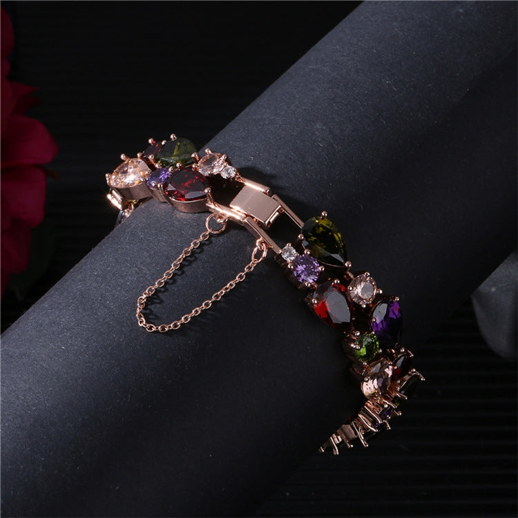 Rose gold bracelet with multicolor zircon stones and extra chain strand
