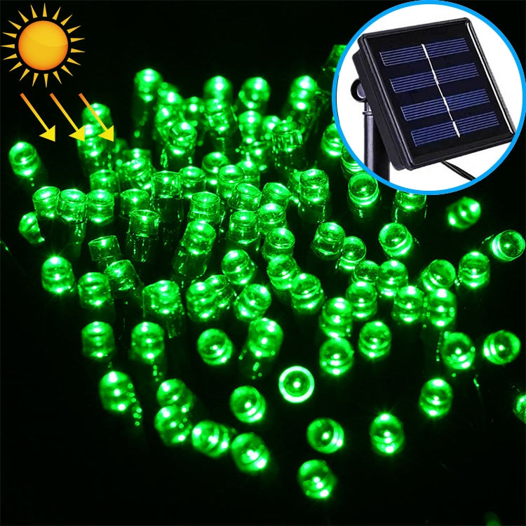 Green LED string lights close-up with black solar panel inset