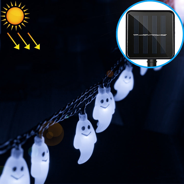 White-glowing ghost-shaped LED string lights hanging along a cord