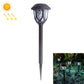 Black solar lawn lamp with lantern head and stake, shown with cool white glow