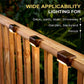 Single black solar railing light mounted on a wooden deck railing, warm LED glow visible.