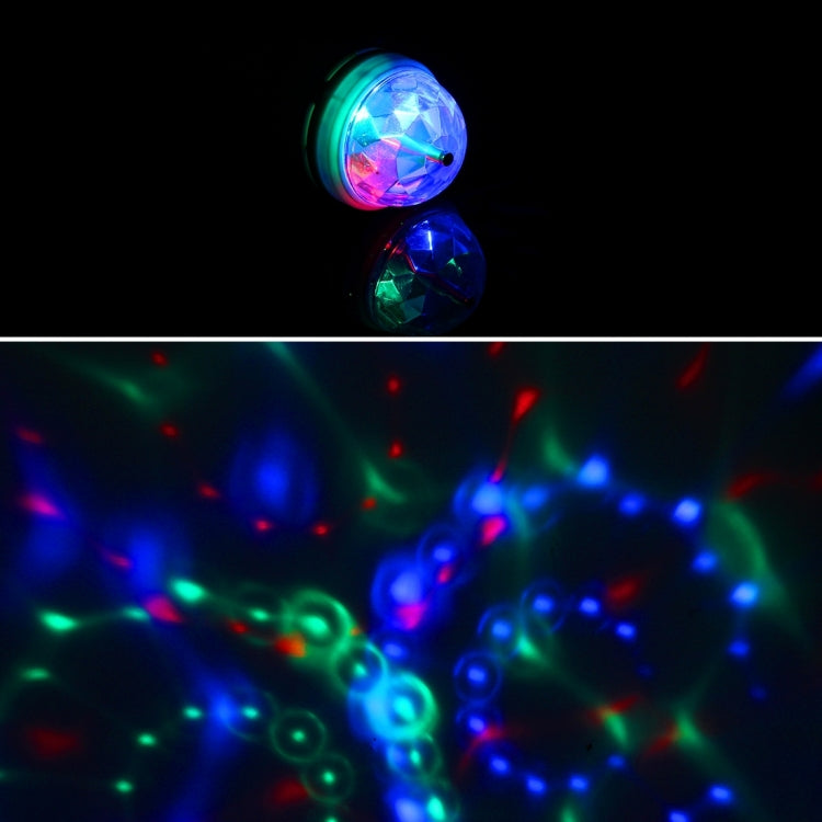 Small E27 LED bulb with green ring producing rotating multicolor light dots