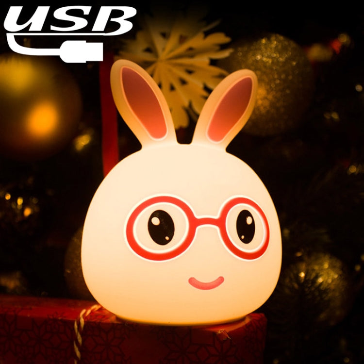 Smiling bunny LED lamp with red glasses, glowing warm light, silicone rabbit shape