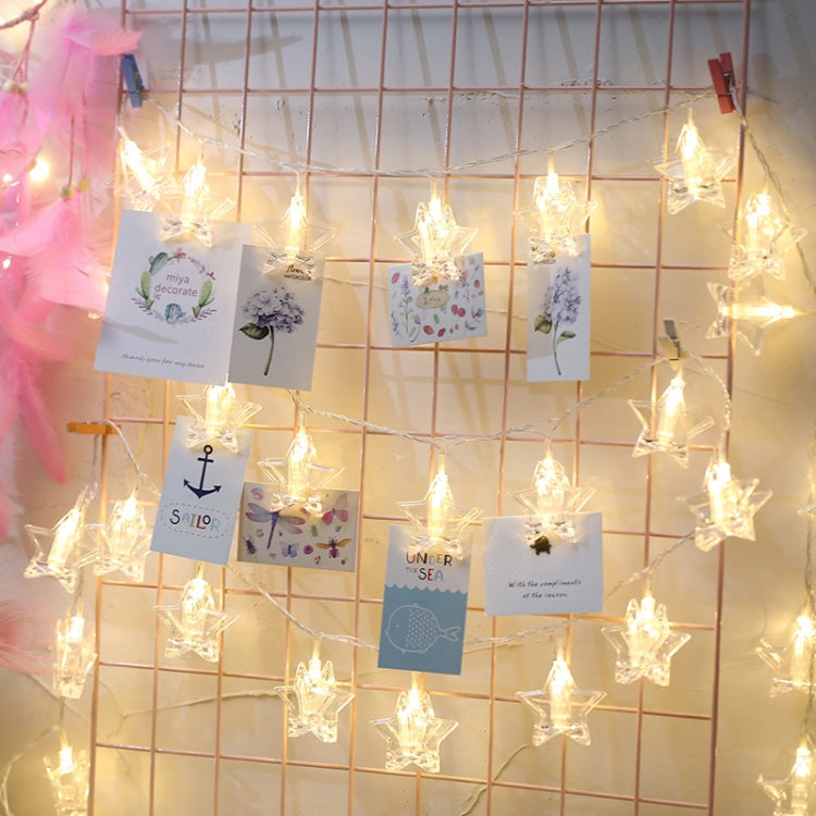 Warm white LED string lights with multiple clear star bulbs for hanging decorations