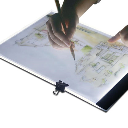 Portable LED art tracing light box with black edges, open panel and drawing sheet