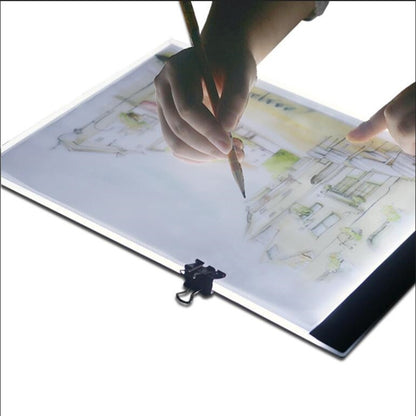 Portable USB LED tracing light box with artwork illuminated by a white panel