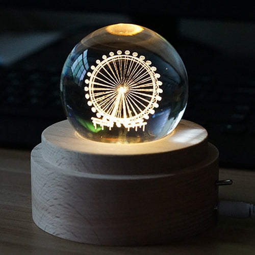 Glowing crystal ball music box night light on round wooden base with circular light motif.