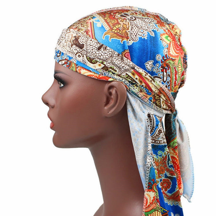 Printed headscarf cap with long neck tie, multicolor motifs, tied back drape