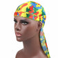 Camouflage pirate turban cap worn on head with long side tail and red/blue/green print