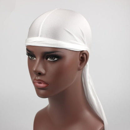 White long-tailed headscarf hat on a mannequin with elastic band and tied back tails