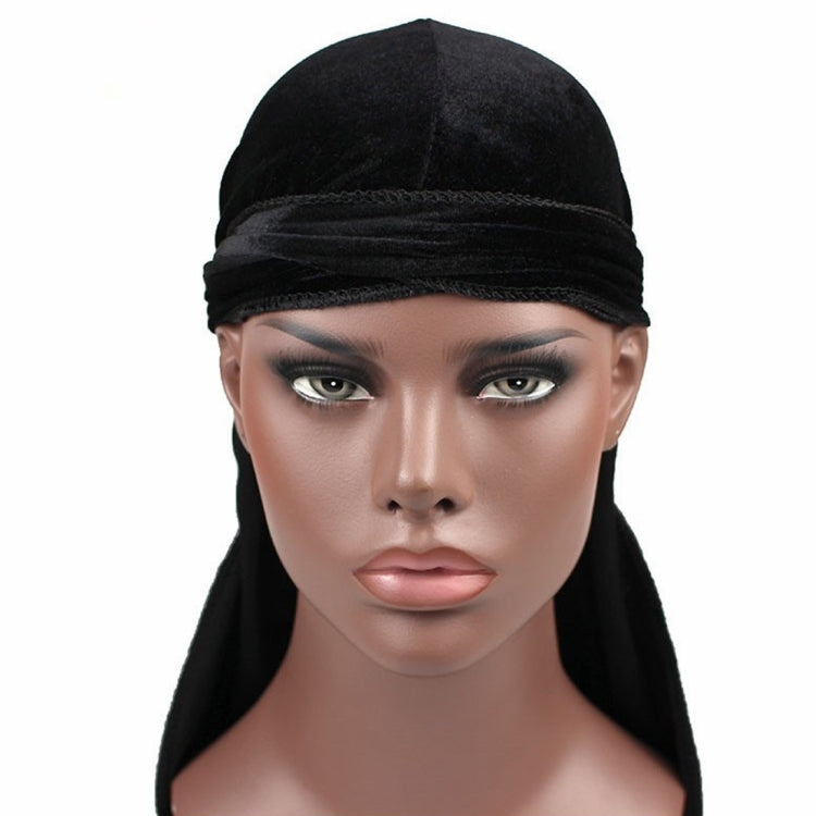 Black velvet turban cap with folded band and long trailing tail