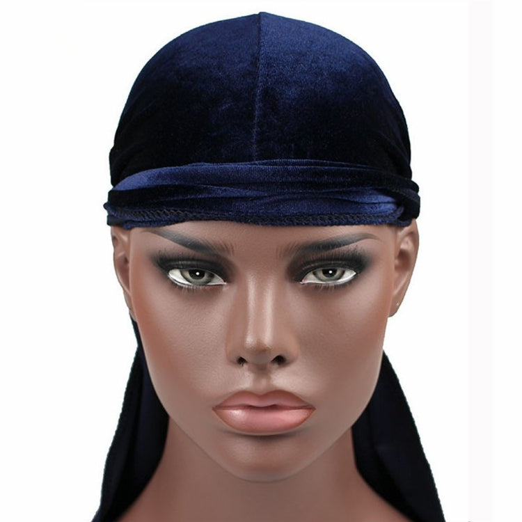 Navy velvet turban cap with wide band and long back drape tail