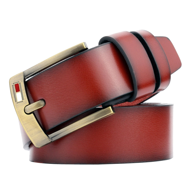 Men’s brown leather belt close-up with gold pin buckle and stitched edge