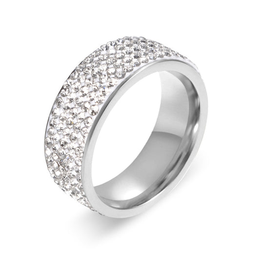 Silver eternity ring with round rhinestone inlay and polished band, curved side view