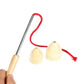 Wooden cone spinning top toy with metal rod and red string, shown with cone bases