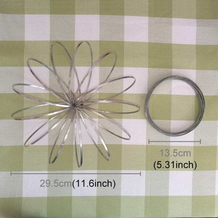 Stainless steel spring bracelet fidget toy with stacked circular wire rings, laid out flat