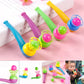 Children's hanging blow ball toy set with blue, purple, green, and yellow handheld blowers