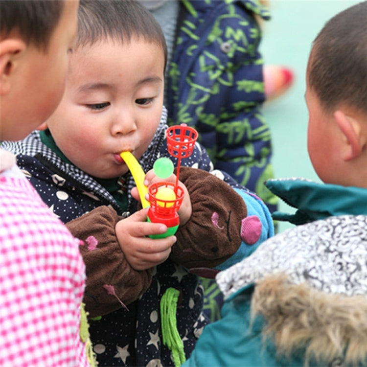 Children playing with a colorful hanging blow ball toy with ball cage