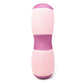 Pink cylindrical lumbar pillow with purple band and rounded end cap