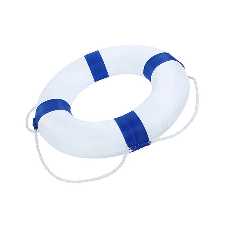 Side view of white foam swim ring with blue support bands and rope lanyard