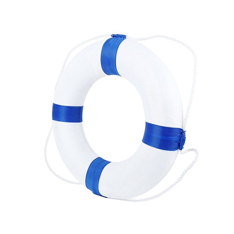White foam swimming ring with blue bands and attached rope, for child use