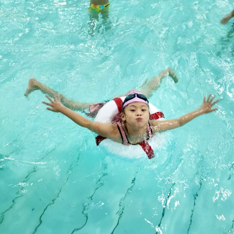 Child swimming while wearing a white foam swim ring with blue accents