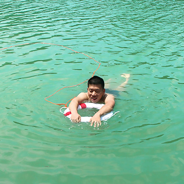 Person holding a white foam swimming ring with blue accents in a pool