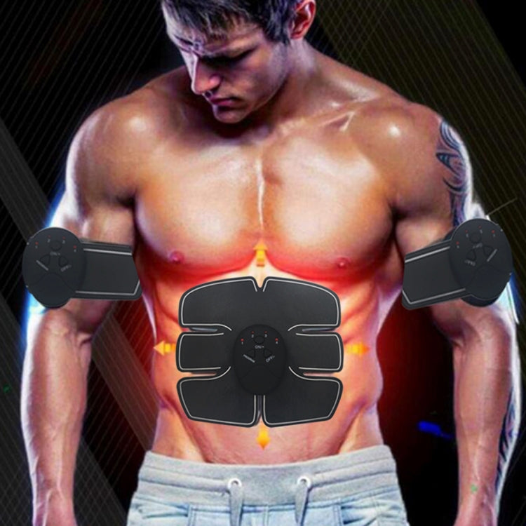 EMS electrode muscle stimulator pads placed on chest and arms with controller
