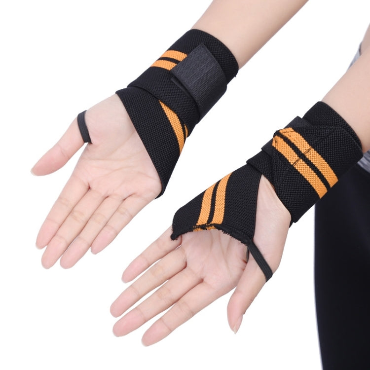Two black elastic wrist wraps with orange triple stripes worn on hands and forearms