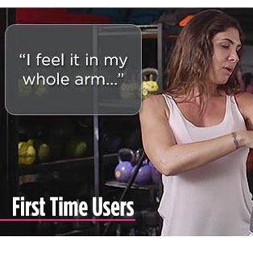 Arm strength training device in use on upper arm with white straps